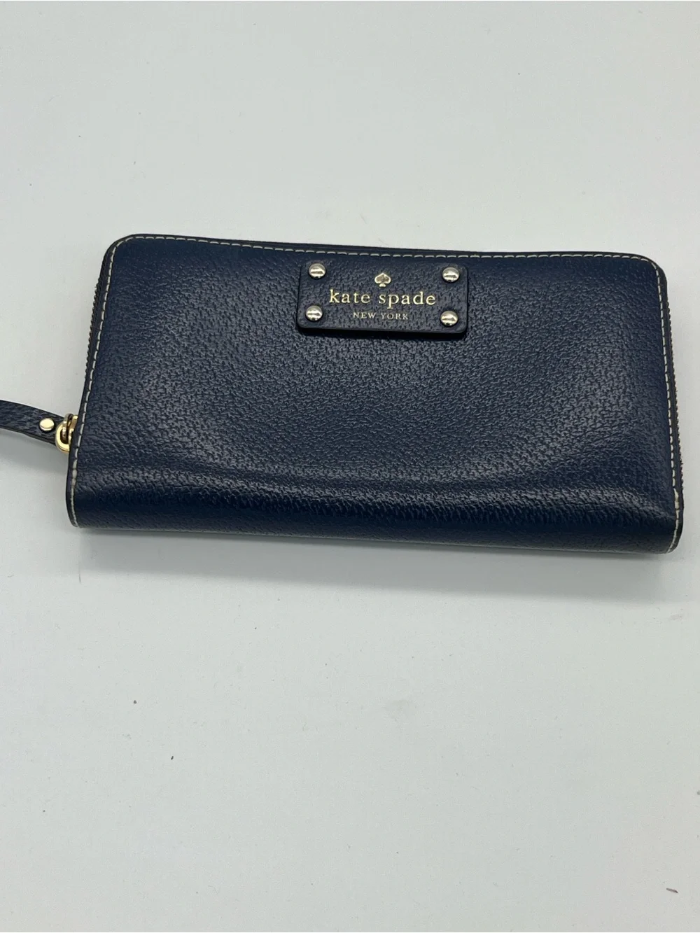 kate spade navy pebbled leather zip wallet with gold plaque